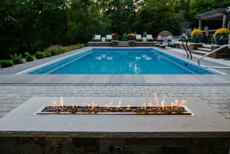 Outdoor Minimalist Firepit near Pool, Weller Brothers Landscaping