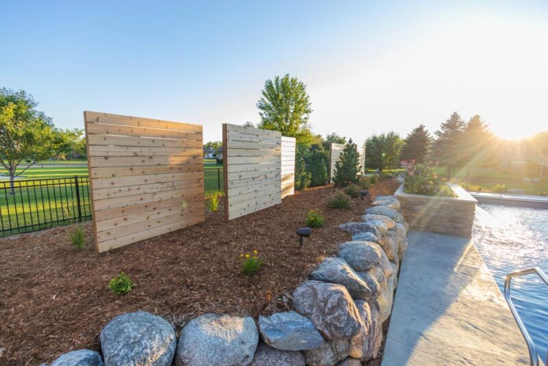 Rock retaining wall with windbreak feature, Weller Brothers Landscaping