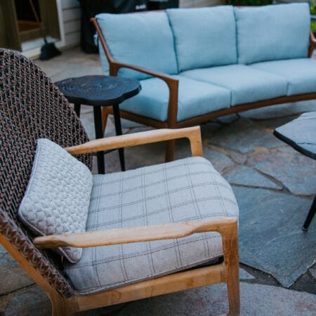 detail shot of outdoor teakwood chair and couch