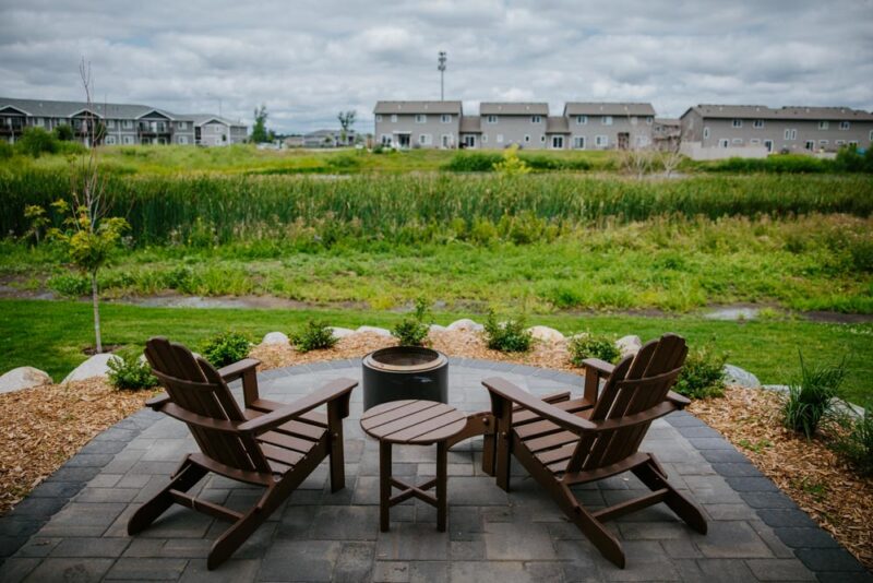 Patio with Firepit over looking back yard 