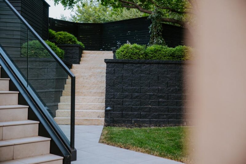 Modern Black and Cream Stairs built into retaining wall, Weller Brothers Landscaping