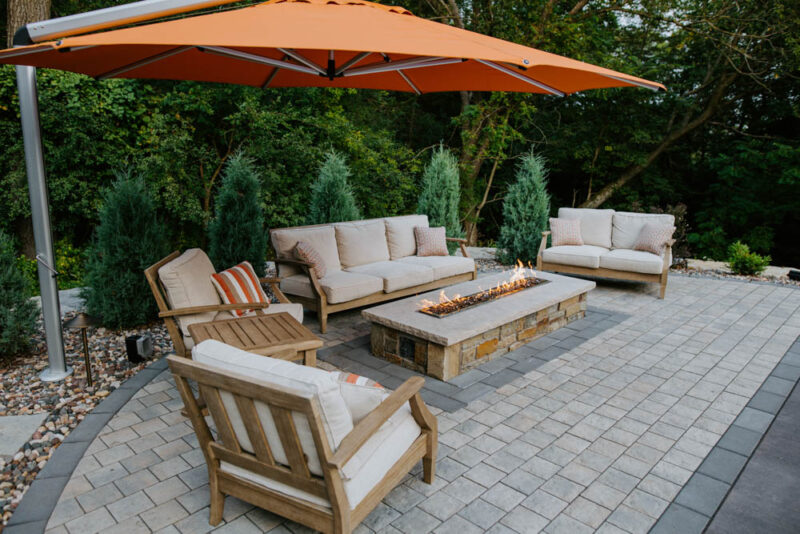 Bright and Cozy Patio with Furniture Design and Firepit, Weller Brothers Landscpaing