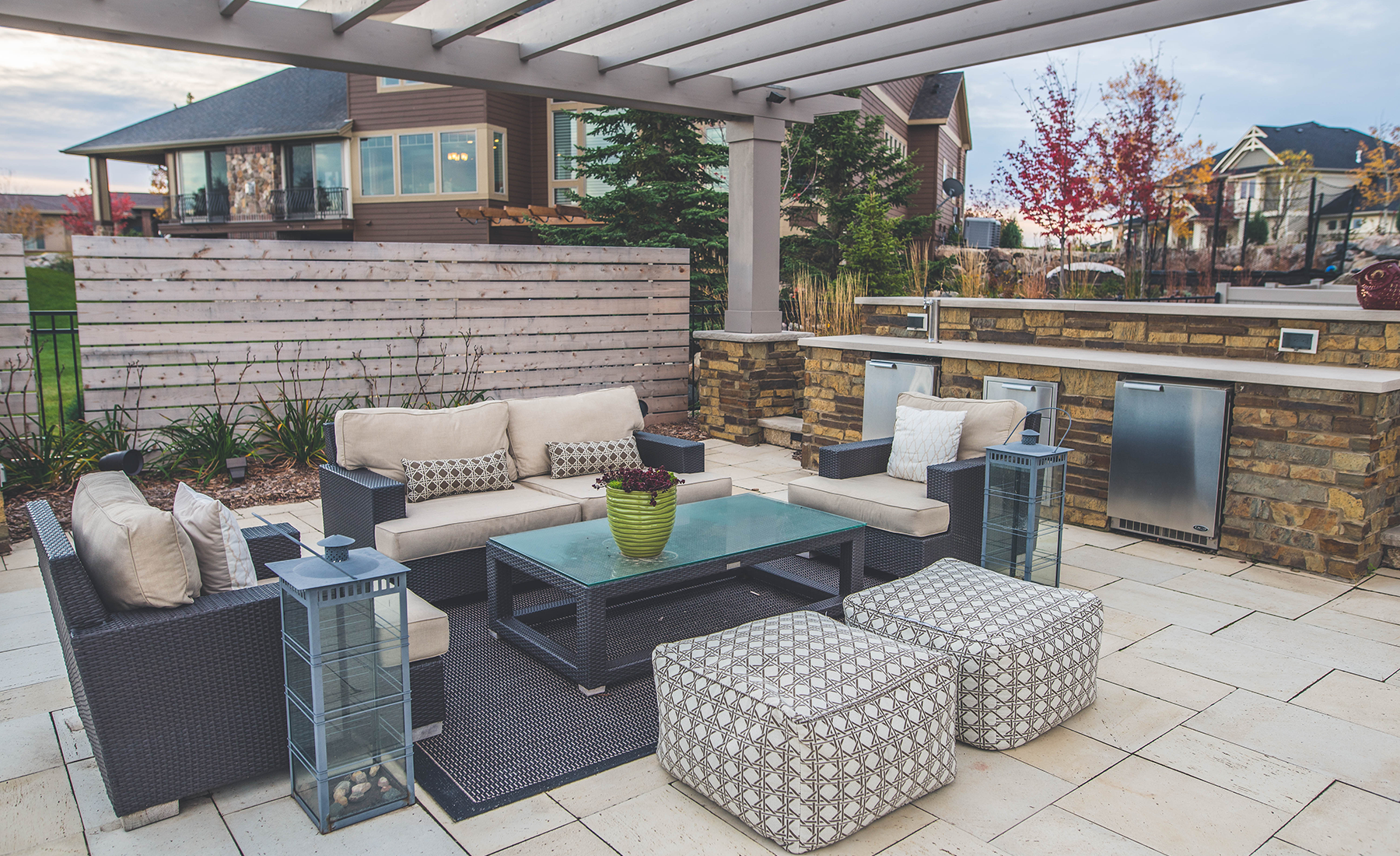 outdoor seating area with bar by Weller Brothers Landscaping