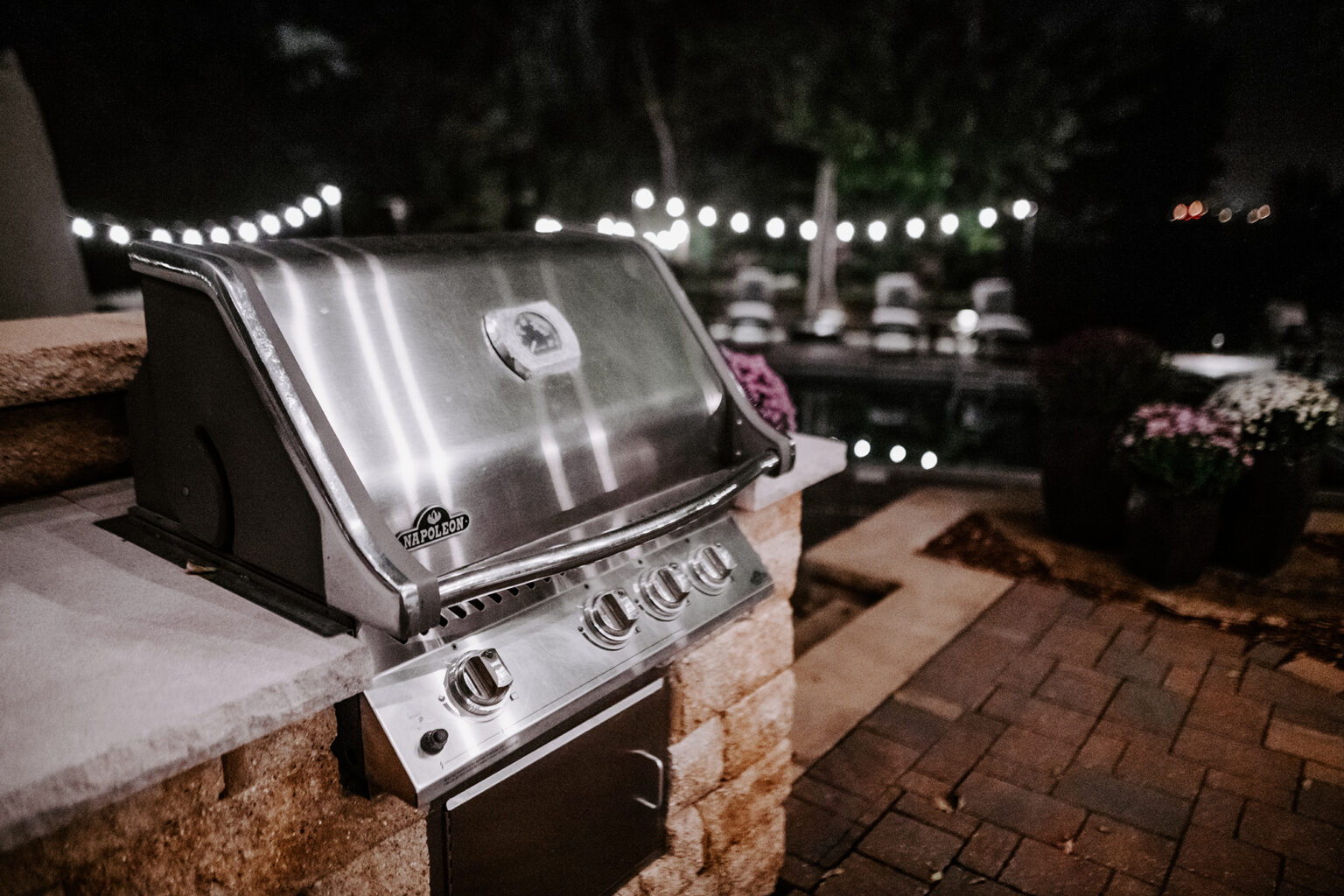 outdoor kitchen with custom lighting