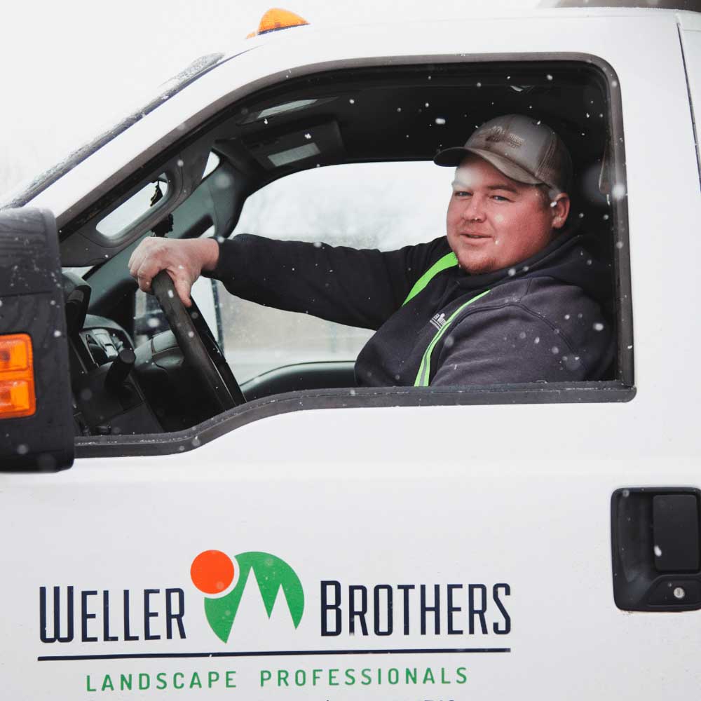 Dillan in Weller Brothers Snow Plow Truck