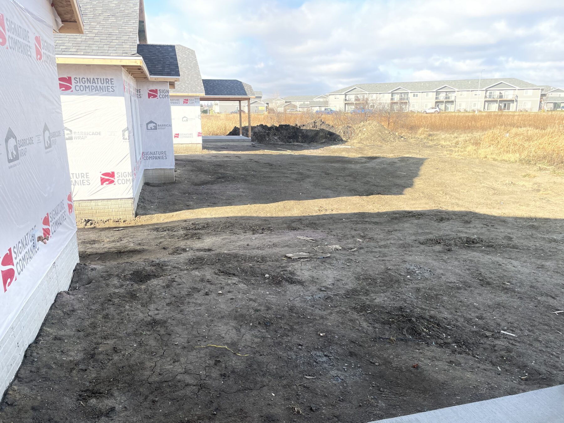 Brown, grassy lawn on a new build