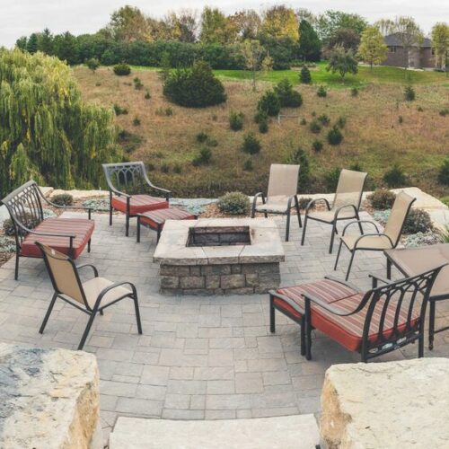 backyard concrete patio with firepit