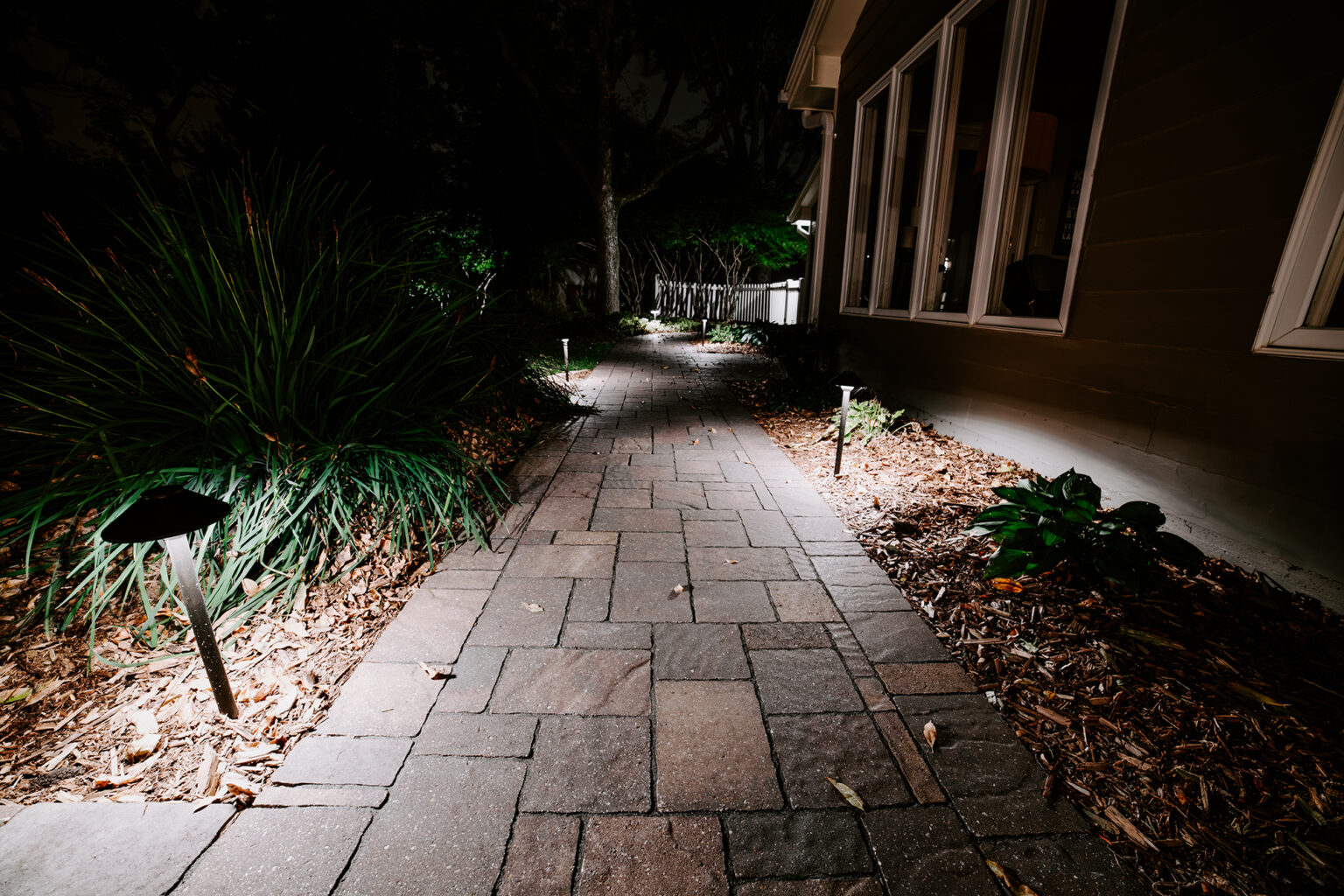 lit backyard patio at night