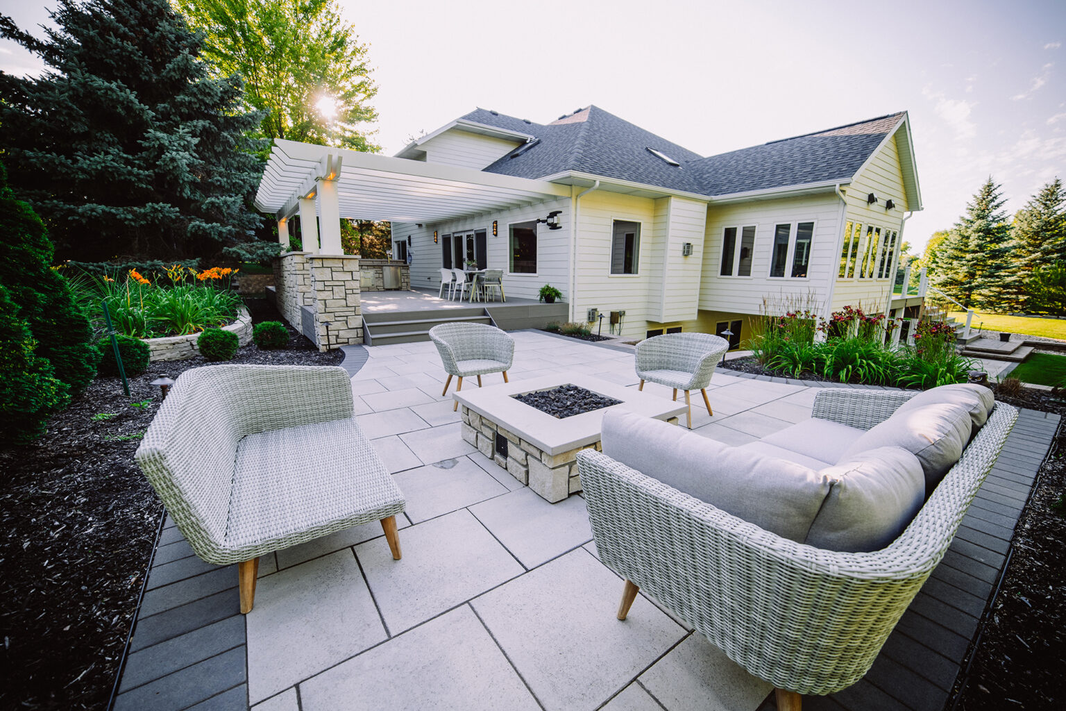 large white house with custom backyard patio landscaping