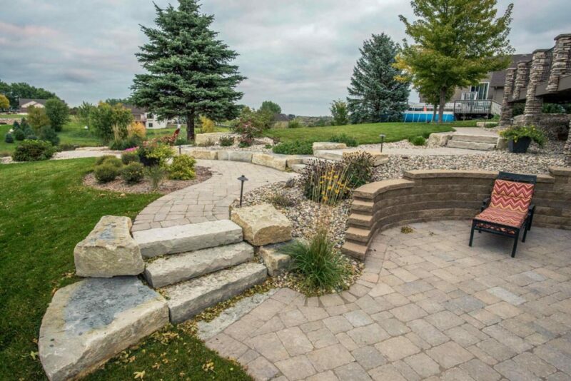 Rock retaining wall with rock landscaping, Weller Brothers Landscaping