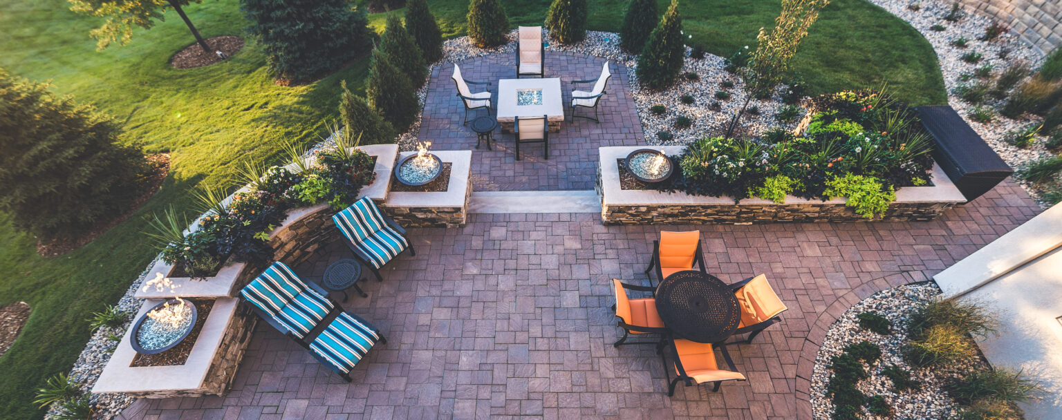backyard paver patio, fire pit, and fire bowls by Weller Brothers Landscaping