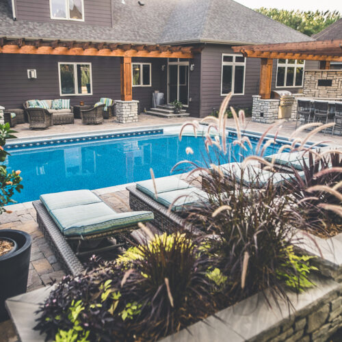 Raised plant beds alongside pool