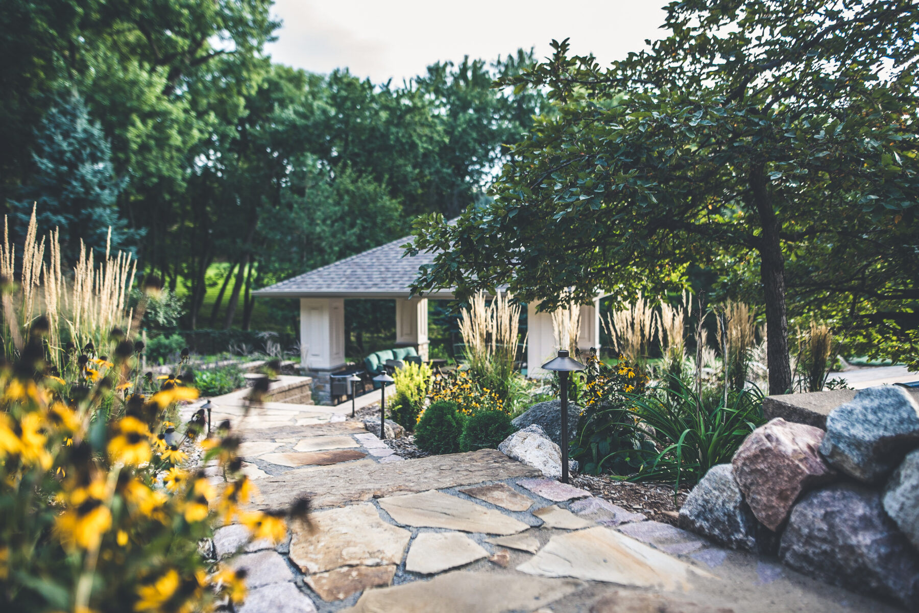 flower beds and custom backyard patio