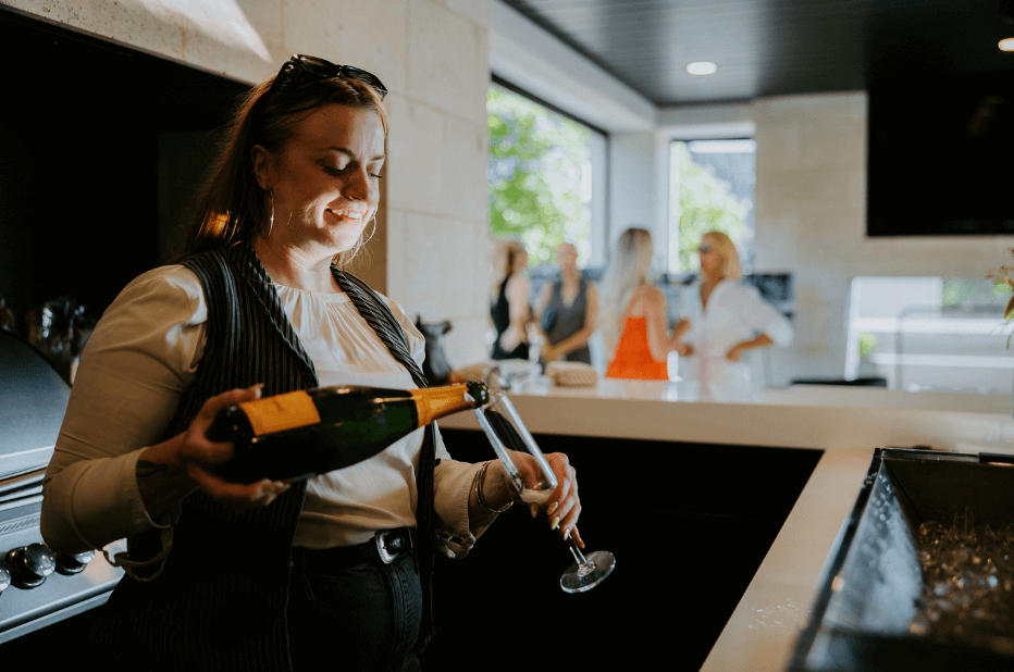 bartender pouring champagne