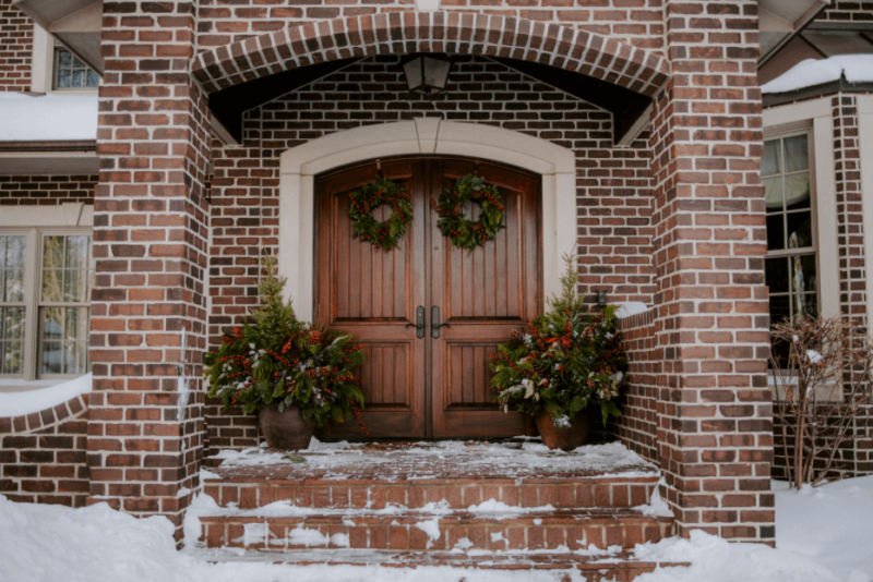 Front porch with festive Christmas greenery