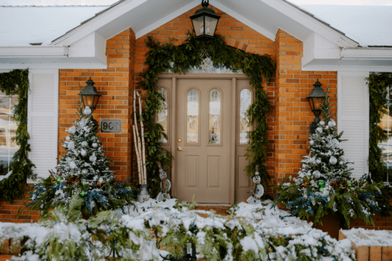 Front porch with festive Christmas greenery
