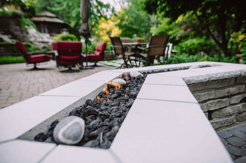 Fireplace in a natural patio, Weller Brothers Landscpaing