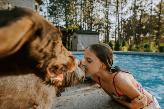 young swimmer with dog