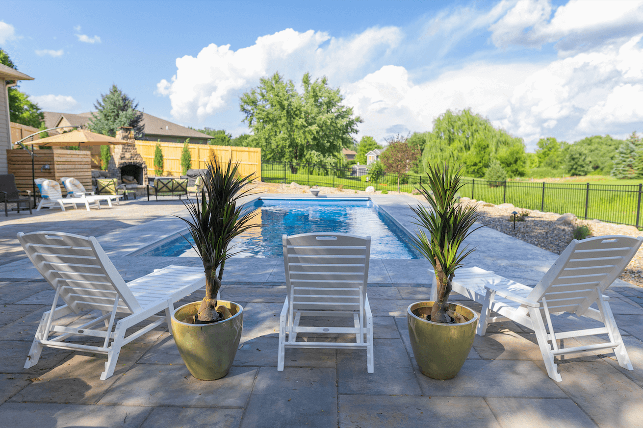 backyard pool with outdoor plants
