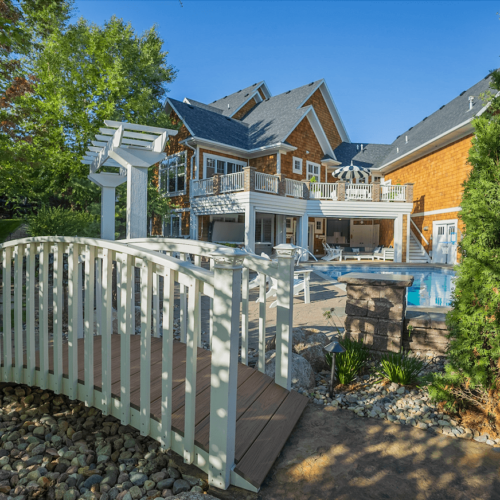 footpath with bridge in front of house