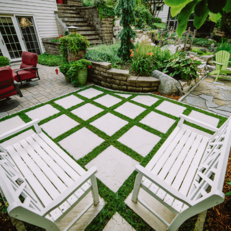 tile patio with green turf and patio furniture