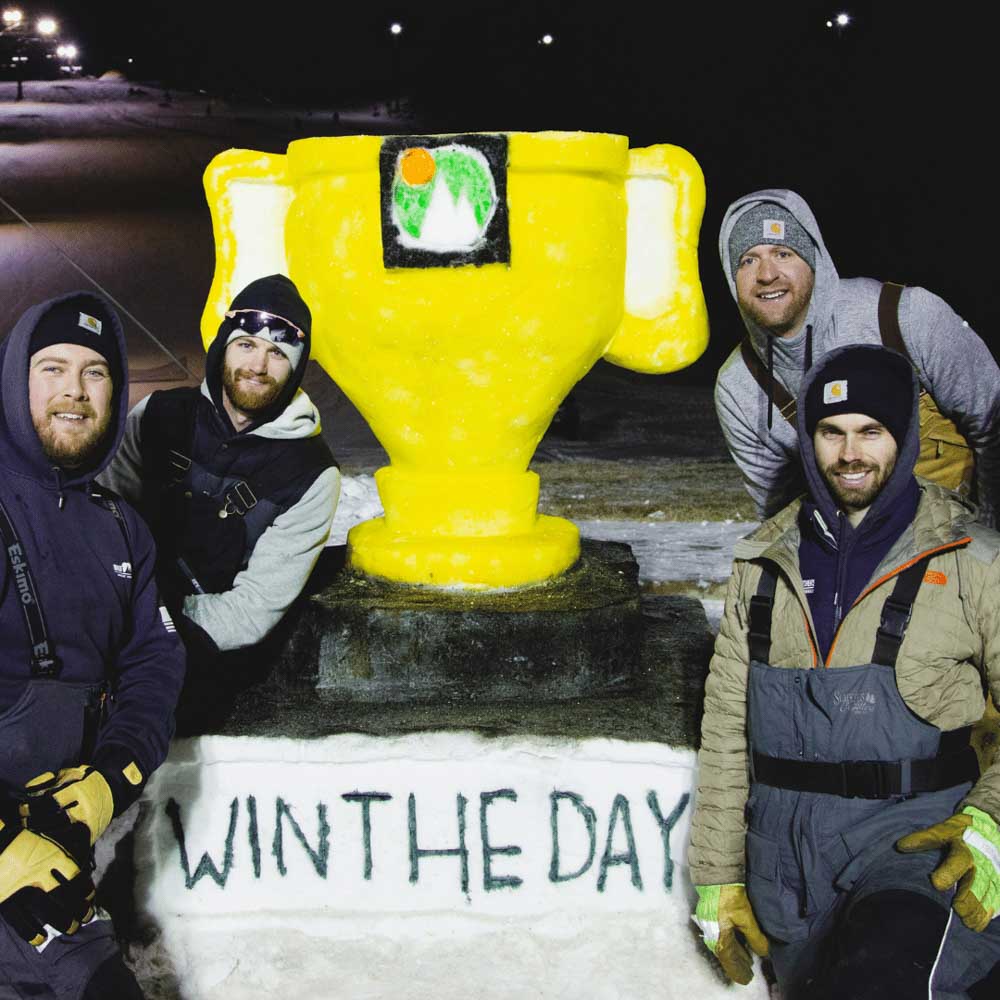 Team with snow sculpture