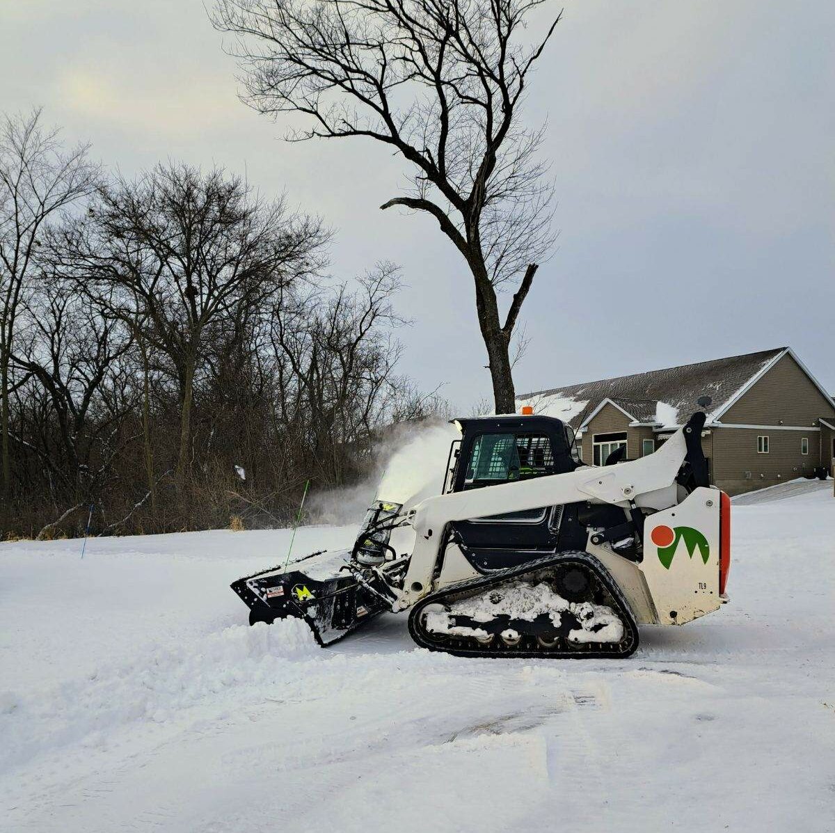 Weller Brothers skid moving snow