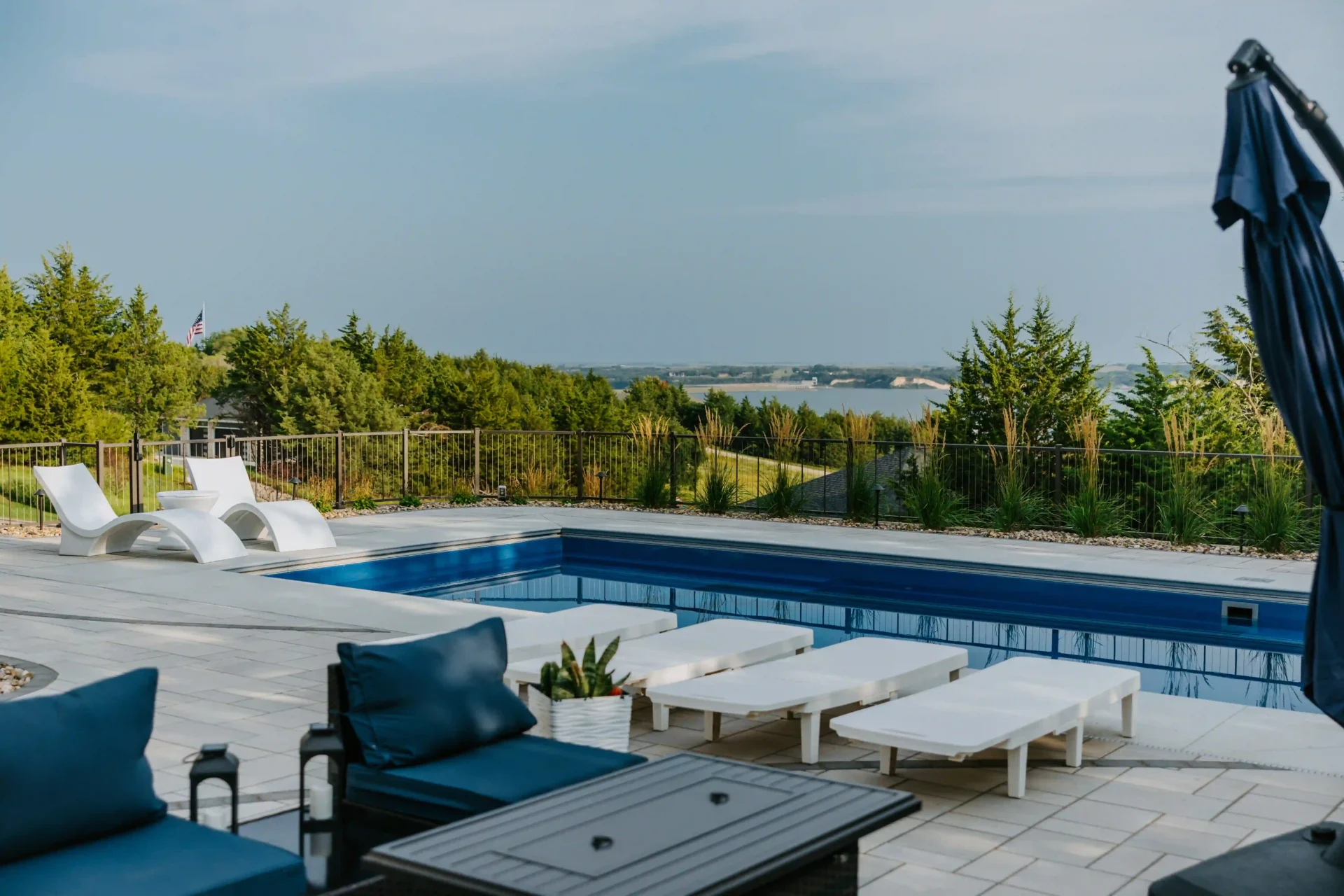 a backyard pool deck overlooks the missouri river