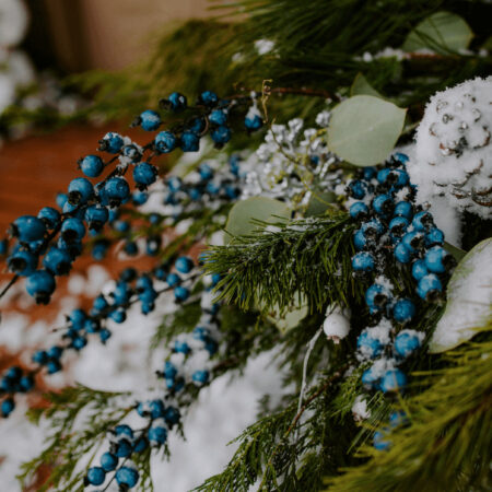 close up of berries sand pine cones in a planter