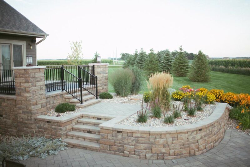 Desert inspired retaining wall with landscaping floral, Weller Brothers Landscaping