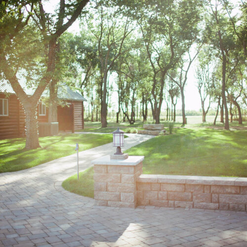 sunlit custom patio and walkway by Weller Brothers Landscaping in Sioux Falls
