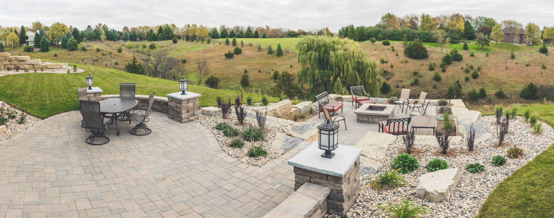 custom hillside patio and fire pit